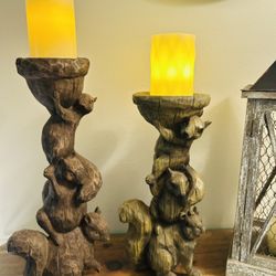 A Pair of Stacking Squirrels with Acorn Top Candle Holders