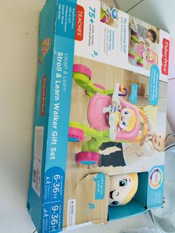 Baby strolller that plays music and phrases; has a free additional doll; never used, ; original price is $67.88 ; sell for $33