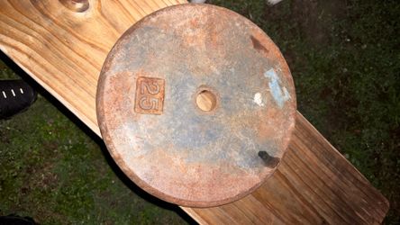 25 lb “pancake” style weight plate manufactured by Cap