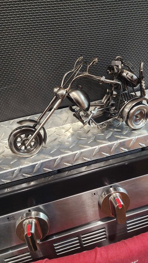 NUTS AND BOLTS METAL LADY MOTORCYCLIST SCULPTURE W/STAINLESS STEEL TREAD PATTERN SHELF