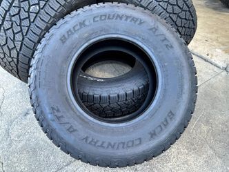 INSTALL - 33" LIKE NEW BACK COUNTRY A/T TIRES 10 PLY LT285/70R17 LOAD-E