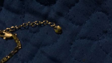 Golden bracelet with heart