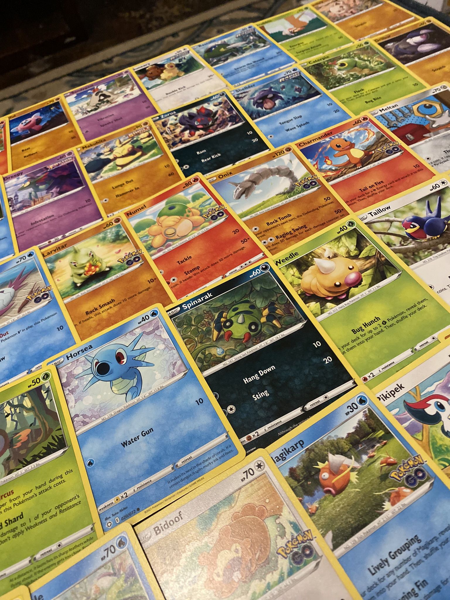 100 Common/Uncommon Official Pokemon Card Bulk Lot (includes 2 Bonus Holo & 1 V)