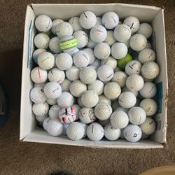 Box full of golf balls around 400