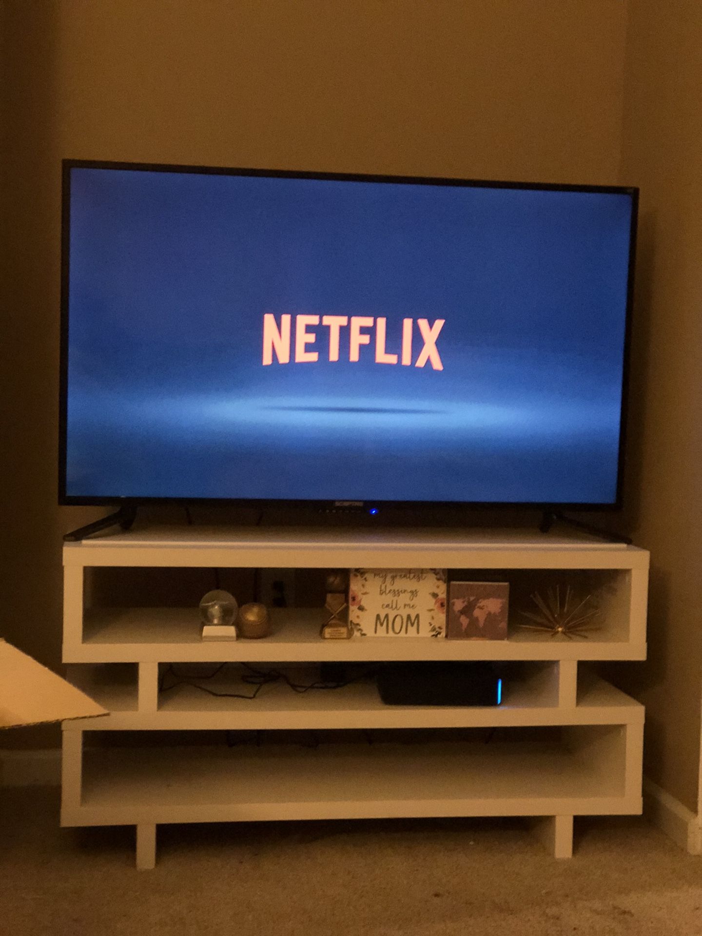 55 Inch TV with access to Apps and Modern TV Stand