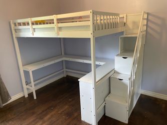 White loft bed with Desk space below.