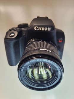 Canon EOS Rebel T8i DSLR camera with an EF-S 18-55mm f/4-5.6 IS STM lens.