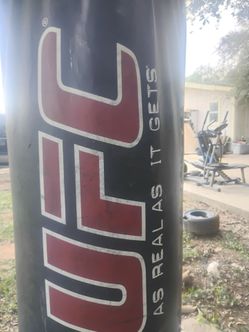 Ufc punching bag and 16 ounces gloves