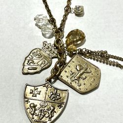 Medieval shield coat of arms lions cross fleur de lis heraldry gems charms gold metal chain necklace jewelry