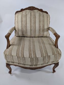 Ornate Carved Wood Armchair with Striped Upholstery