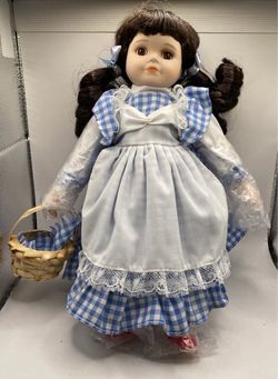 a Royalton Collection 9.5-inch Porcelain Dorothy Doll from The Wizard of Oz