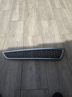 Passenger-side lower front bumper grille mesh with silver trim molding for a 2010–2013 Acura MDX.