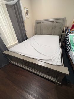 Gray Wood Sleigh Bed Frame with two night stands