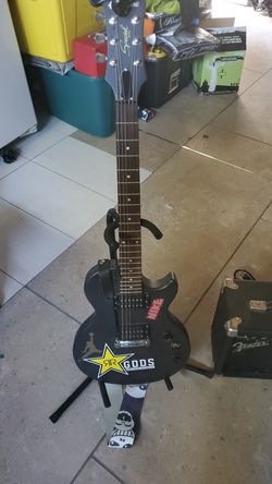 Electric guitar with amplifier, stand, strap, tuner included