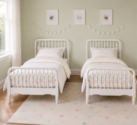 Twin beds with mattresses