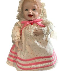 THIS BABY DOLL IS ADORABLE IN HER LITTLE NIGHTIE, MATCHING HAT BLOOMERS, AND BUNNY SLIPPERS. HER LITTLE DRESS IS PATTERNED IN LITTLE PINK ROSES. SHE S