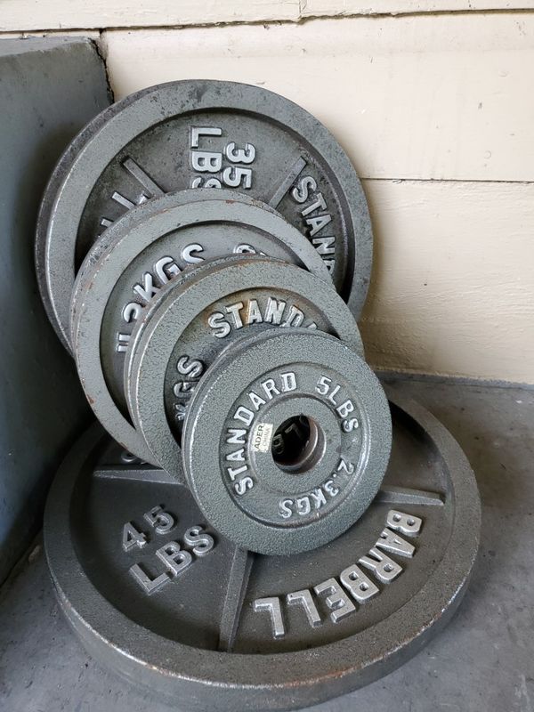 Olympic weight set bench, bar and 255lbs of weight plates. Bar is 45lbs