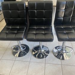 Three Black Chairs