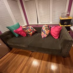 Chic Gray Sofa with Studded Arms & Pillows