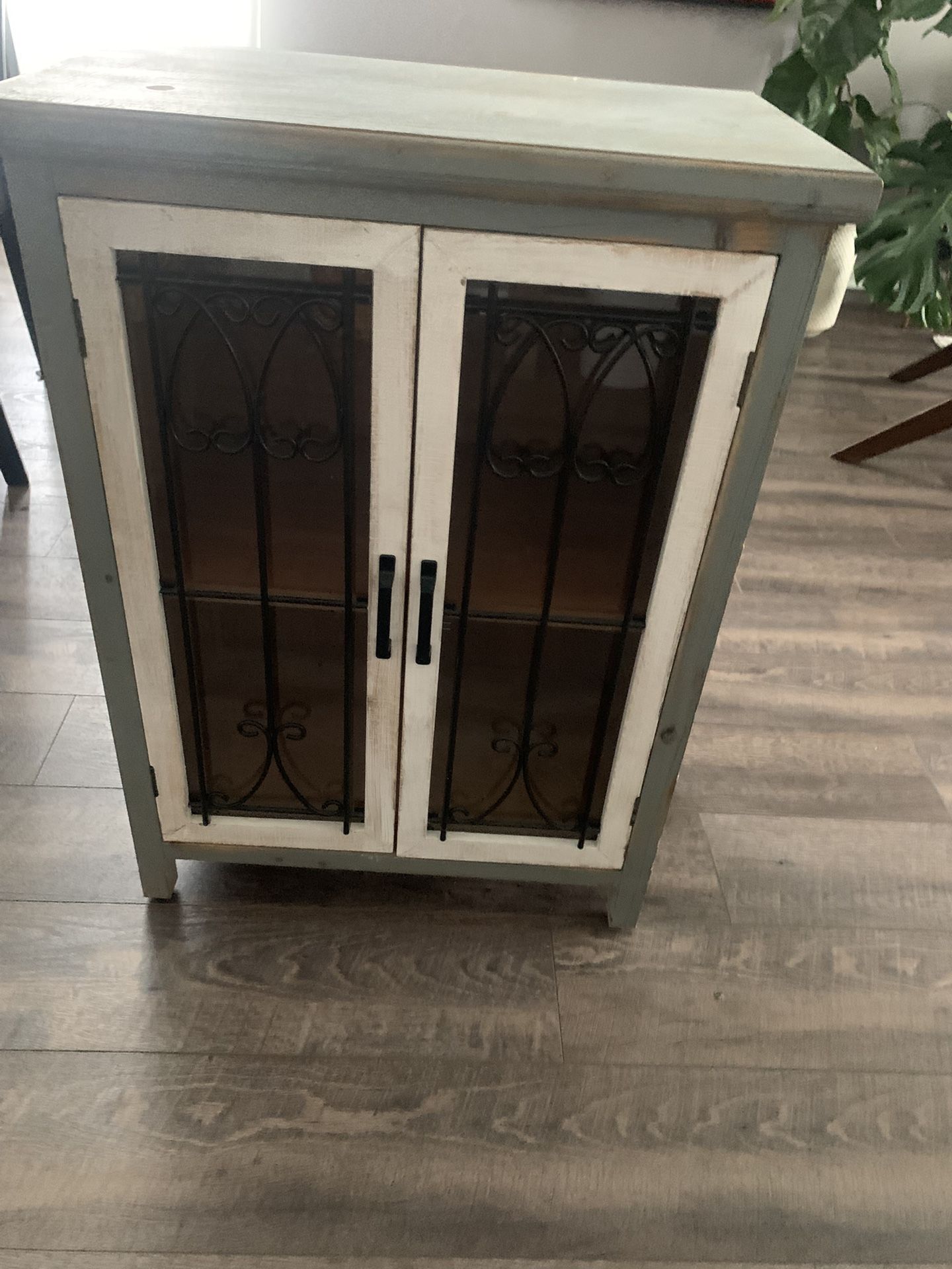 Farmhouse-style accent cabinet.