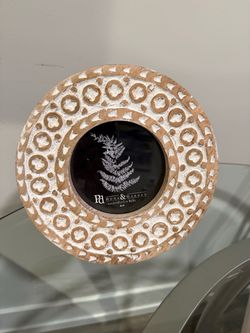 Handcrafted round picture frame made of wood with a white-washed carved design 4x4