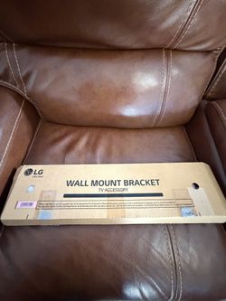 Brand new (opened only to check contents) LG official wall mount bracket – part MEC0. Designed specifically for LG 77” OLED77G and OLED77Z Gall