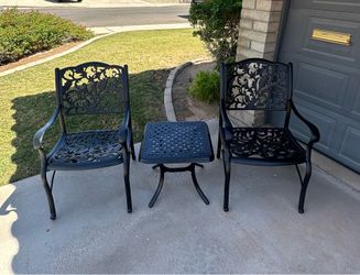Patio set. Chairs and a table. Bistro style. Very nice condition. All metal.