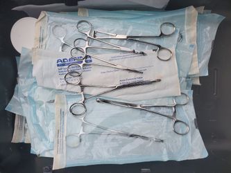 body piercing forceps, jewellery, catch and other needed tools for body piercing.