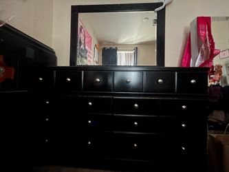 Black dresser with mirror and night stand