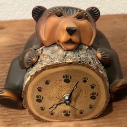 Montana Wax & Wood Bear holding a removable battery operated click
