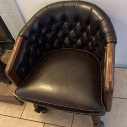 A Nice Lather Chair With Wheels