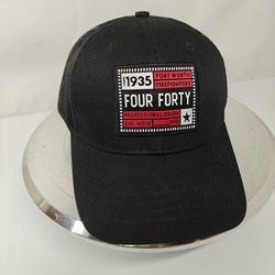 black graphic cap featuring a patch commemorating the "Fort Worth Firefighters" established in 1935
