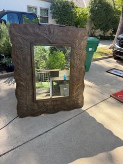 Large antique bronze mirror