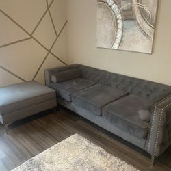 Grey velvet couch with ottoman that has storage 