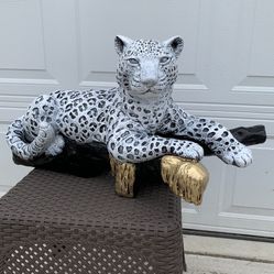 Snow Leopard On The Log Statue 