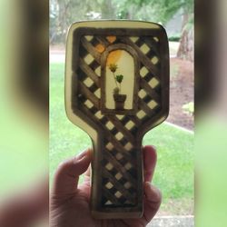 Cutest vintage spoon rest. Not sure if this is made of lucite but I think so. Nice scene of window with sun and flowers. 