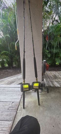 2 new  Shimano  reels and poles