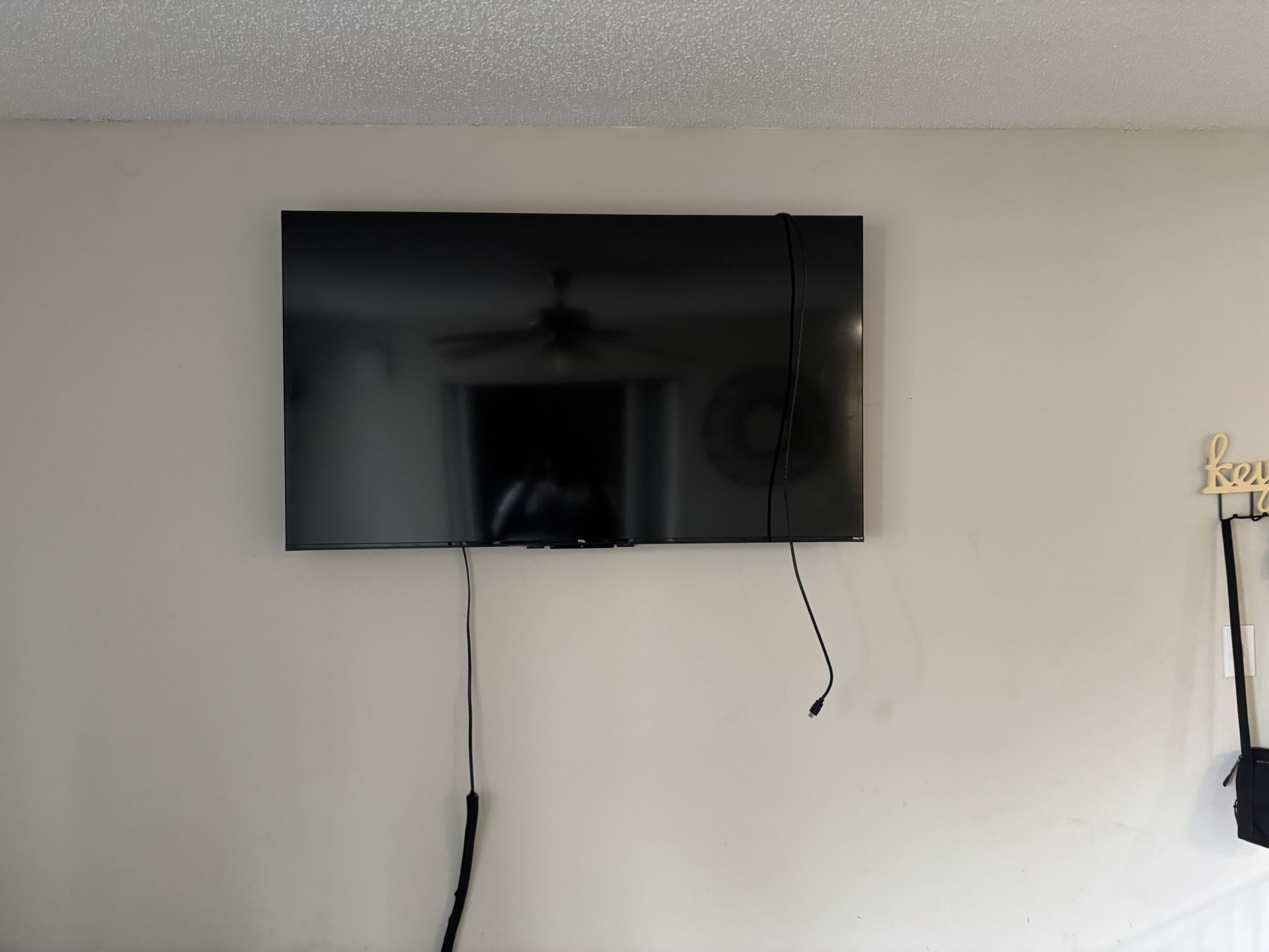 Two TCL TVs