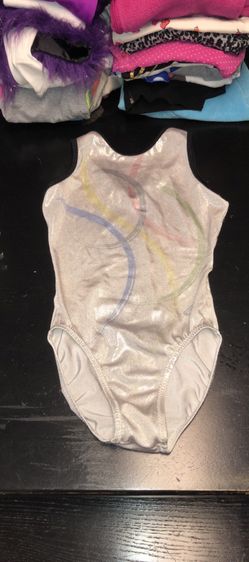 Kids size 12 shimmery silver gymnastic leotard with the Olympic Rings on the front in excellent condition