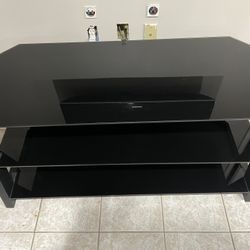 TV Console table - Black Glass in Great Condition. $130 OBO. Local Pick Up Only. 