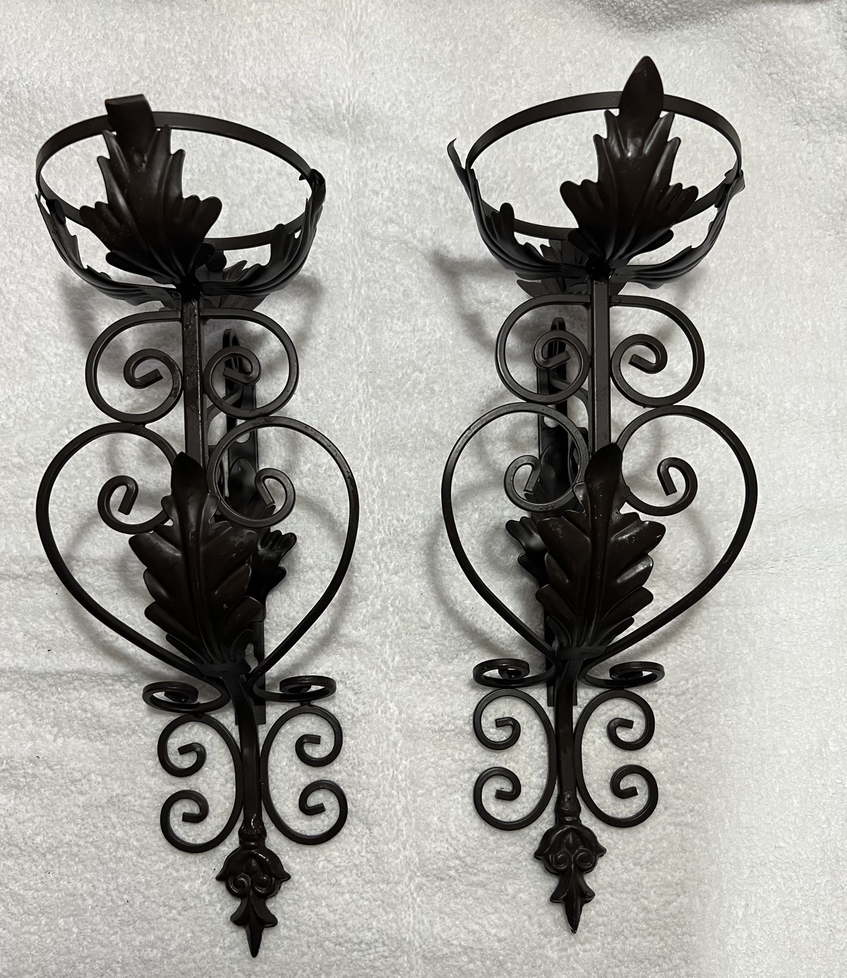 Wrought iron wall sconce candle holders