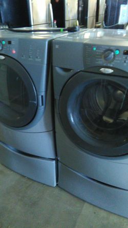 Whirlpool front load washer and dryer with pedestal one year warranty delivery available