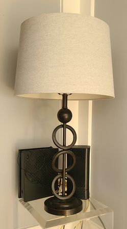 Solid Table Lamp With Beige Shade.