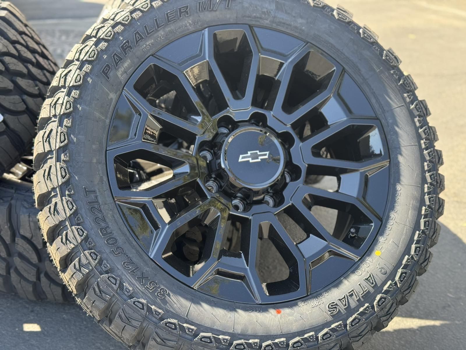 22" Black Wheels 22x9 8x180 Rims and 35” Tires 3500 Chevy 2500 Silverado Chevrolet GMC Sierra Denali HD 2500HD 3500HD AT4 Ultimate
