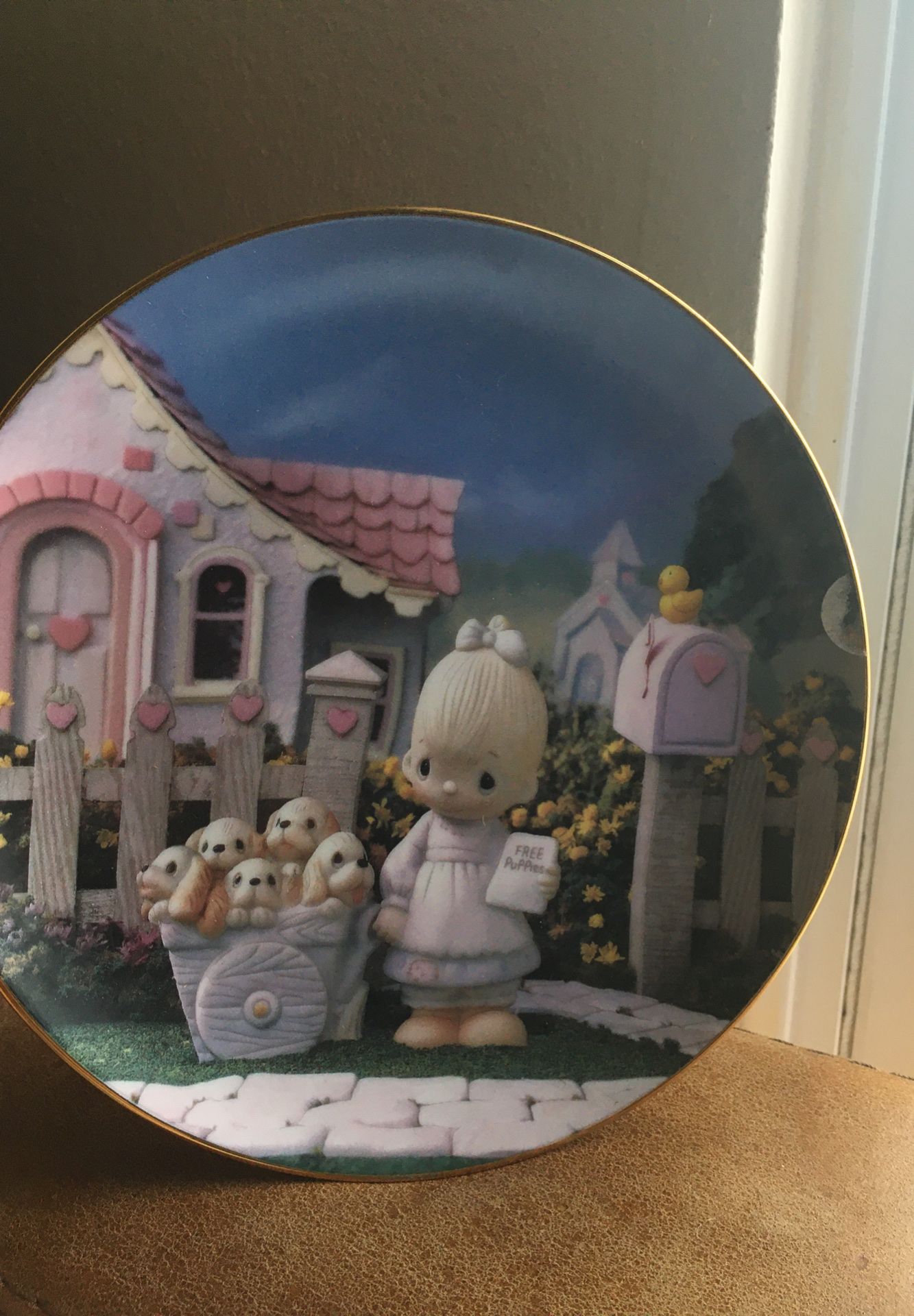 Norman Rockwell and precious moments collection plates