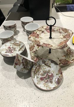 Decorative serving Plate with matching bowls and serving saucers