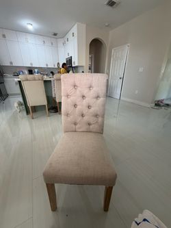 Beige tufted chairs