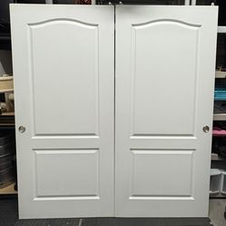 71 3/8” x 78 1/2” Double interior doors, used for closets. 2-panel design.  C#22
