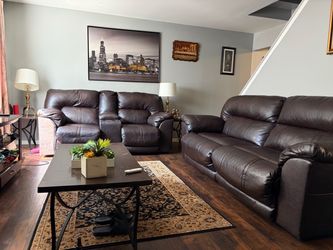 Set of couches with tables and lamps