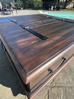 Very large, rustic coffee table with storage and casters wheels